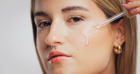 Beauty, skincare and girl with serum in studio for hydration, hyaluronic acid or anti aging...