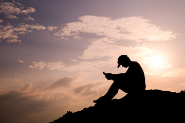 Silhouette of a lonely and hopeless man, heartbroken and disappointed, loneliness concept.