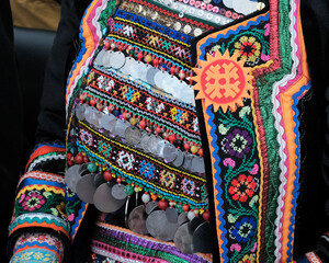 Traditional Mari womens costume with beaded and coins chest ornament and embroidered jacket