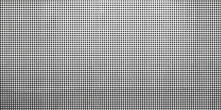 Close-up view of a grid pattern, appearing as small squares, in grayscale