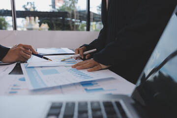 Team of business people working together in the meeting room office,
teamwork background charts and...