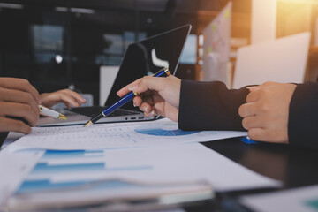 Team of business people working together in the meeting room office,
teamwork background charts and...