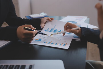 Team of business people working together in the meeting room office,
teamwork background charts and...
