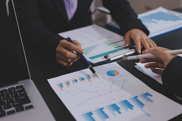 Team of business people working together in the meeting room office,
teamwork background charts and...