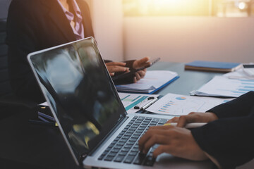 Team of business people working together in the meeting room office,
teamwork background charts and...