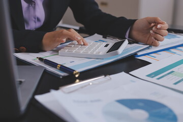 Team of business people working together in the meeting room office,
teamwork background charts and...