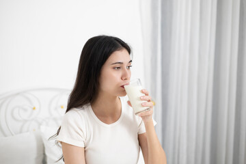 A young woman who likes to drink milk every morning.