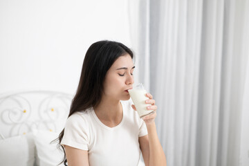 A young woman who likes to drink milk every morning.