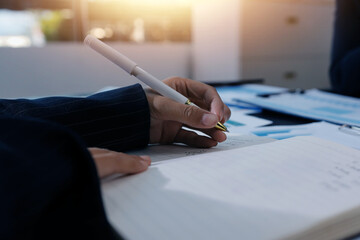 Team of business people working together in the meeting room office,
teamwork background charts and...