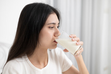 A young woman who likes to drink milk every morning.