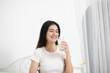 A young woman who likes to drink milk every morning.