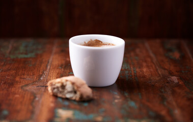 Cup of coffee on rustic wooden background. Soft focus. Copy space	