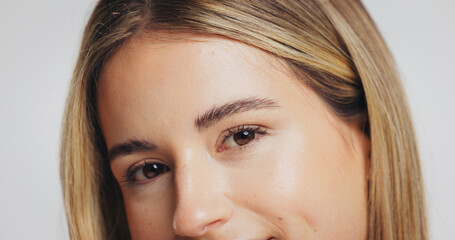 Obraz premium Portrait, woman and beauty for skincare in studio with glow, laminated eyebrows and eyelash extension. Person, cosmetics or natural facial of dermatology shine, treatment results and white background