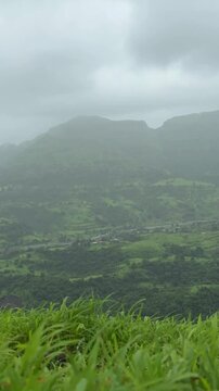 Vertical frame timelapse of Matheran mountain range with moving clouds, Maharashtra