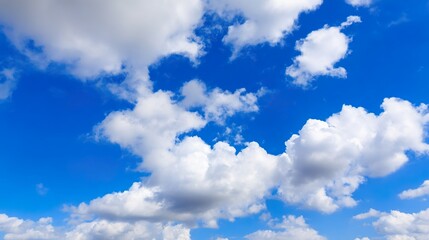 Obraz premium Beautiful Pure White Clouds on Bright Blue Sky: Fluffy White Clouds Against Vibrant Blue Sky, Serene Sky Scene with Soft Clouds—Idyllic Weather for Nature Views