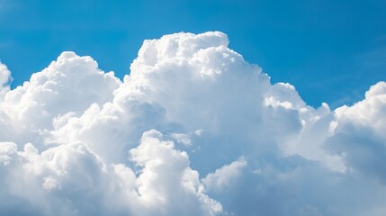 Naklejka premium Beautiful Pure White Clouds on Bright Blue Sky: Fluffy White Clouds Against Vibrant Blue Sky, Serene Sky Scene with Soft Clouds—Idyllic Weather for Nature Views