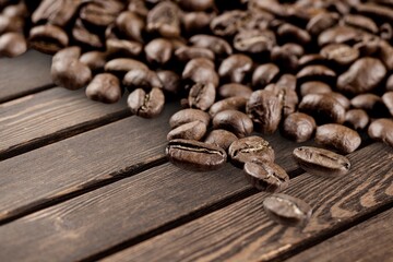 Tasty aroma Coffee beans on wooden table.