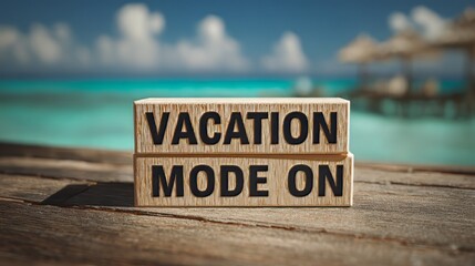 Vacation mode on wooden blocks with a tropical beach background, perfect for travel, relaxation, and summer vacation themes