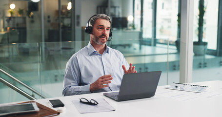Fototapeta premium Telemarketing, discussion and man with laptop in call center, talk and planning for lead generation. Agent, communication and explaining offer to contact, chat and mature person with mic for sales