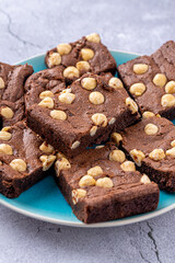 Homemade chocolate brownie photography . Top view on rustic background.Rich chocolate brownie , showcasing its dense texture and glossy surface, professional food photography.