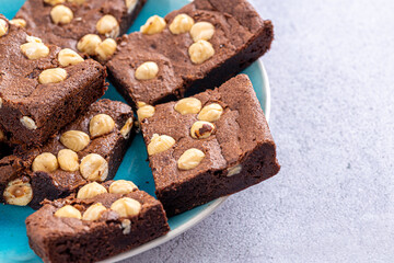 Homemade chocolate brownie photography . Top view on rustic background.Rich chocolate brownie , showcasing its dense texture and glossy surface, professional food photography.