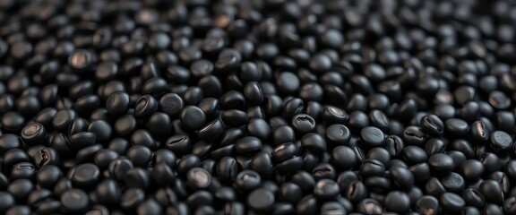 Close-up of dark, shiny black beluga lentils, scattered on a surface,  close-up,  natural