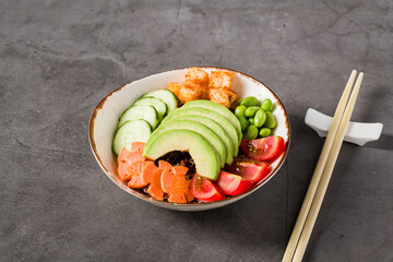 Colorful vegan poke bowl with avocado, edamame, and rice