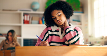 Bored, girl and student writing in classroom for education, learning and studying burnout....