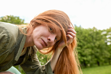 Close-up of a woman enjoying a bright day outdoors in nature