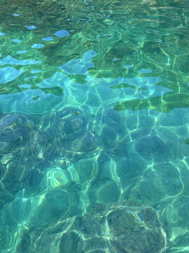 Emerald ocean clear water background vertical.