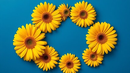 Vibrant yellow gerbera flowers arranged in a circular pattern against a deep blue background, symbolizing joy and energy.
