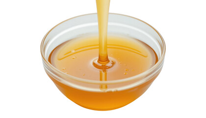 Egg yolk in a glass bowl with hot orange pumpkin cream soup, isolated on a white background