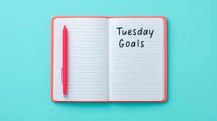 Open Planner with Red Pen and Tuesday Goals Written on Page