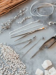 Jewelry making tools and materials including beads and chains on a crafting table, ready for creativity