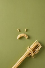A single lonely spaghetti noodle personifying sadness and solitude in a series of minimalist, dramatic, and humorous conceptual photos.