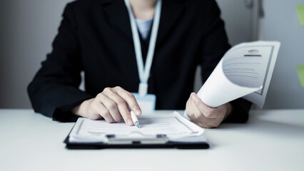 Business woman employer holding resume hiring recruit looking cv resume to hire candidates,...