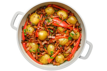 Delicious roasted potatoes with red peppers and bacon cooked in a cozy kitchen