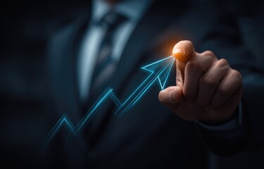 Businessman pointing at a glowing upward trend graph