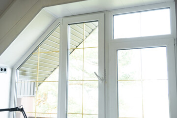 Fototapeta premium Window attic from inside the house plastic double-glazed window, clean glass after cleaning windows, open and closed window, window fittings