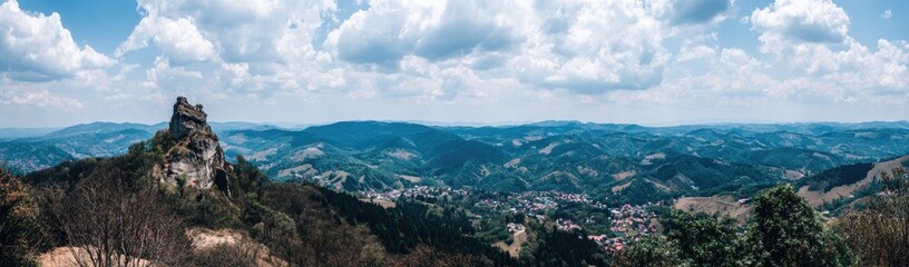 Panoramic mountain vista with a rocky outcrop