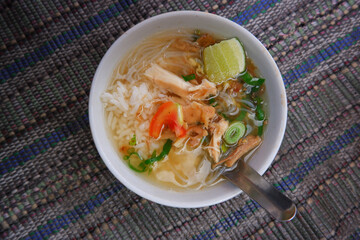 Soto is a traditional Indonesian food consisting of noodles, chicken and broth combined into one.