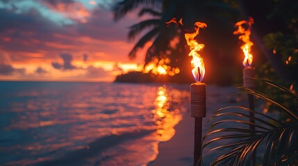Fototapeta premium Two tiki torches burn brightly on a tropical beach at sunset illuminating the serene ocean waves and colorful sky
