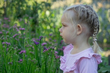 Sad little girl with allergy symptoms outdoors