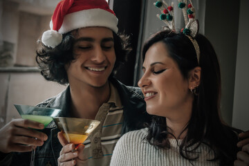 Young couple toasting during the Christmas brunch