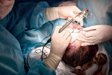 Surgeons performing a medical procedure in an operating room