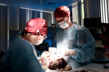 Surgeons Performing a Medical Procedure in a Modern Operating Room