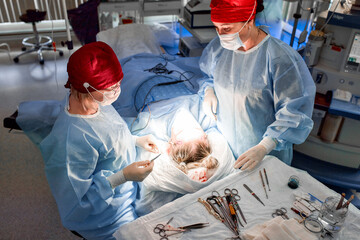 Medical team performing surgery in a sterile operating room