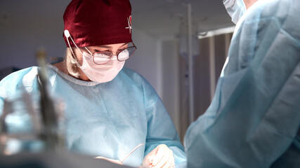 Surgeon performing focused procedures under sterile conditions in an operating room