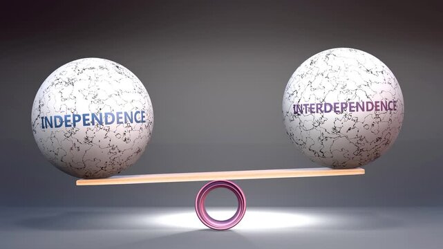 Independence and interdependence in balance - balancing stones on a scale symbolizing harmony, equity and equilibrium between independence and interdependence. Harmonious and beneficial situation.