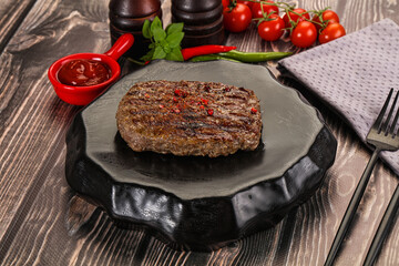 Grilled beef burger cutlet with sauce